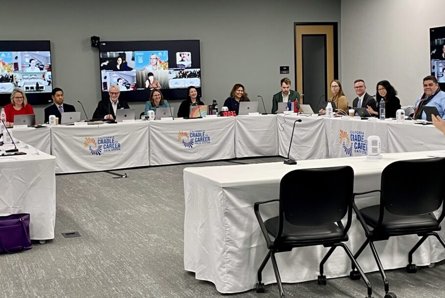 Wide angle image of the Cradle-to-Career Governing Board dias and back view of the presenter's table